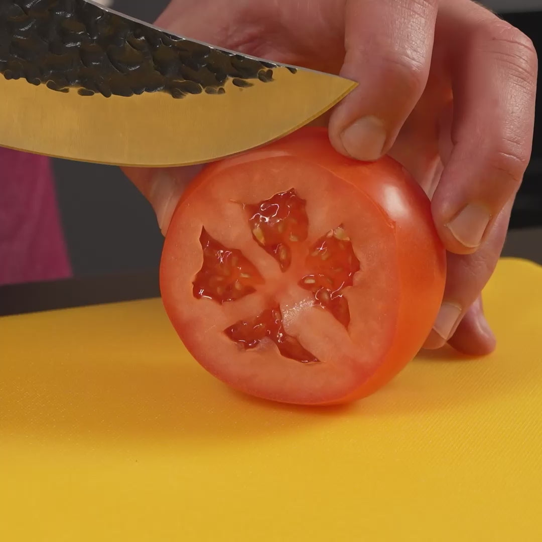 Matsato Osuren knife slicing a ripe tomato paper-thin without squishing